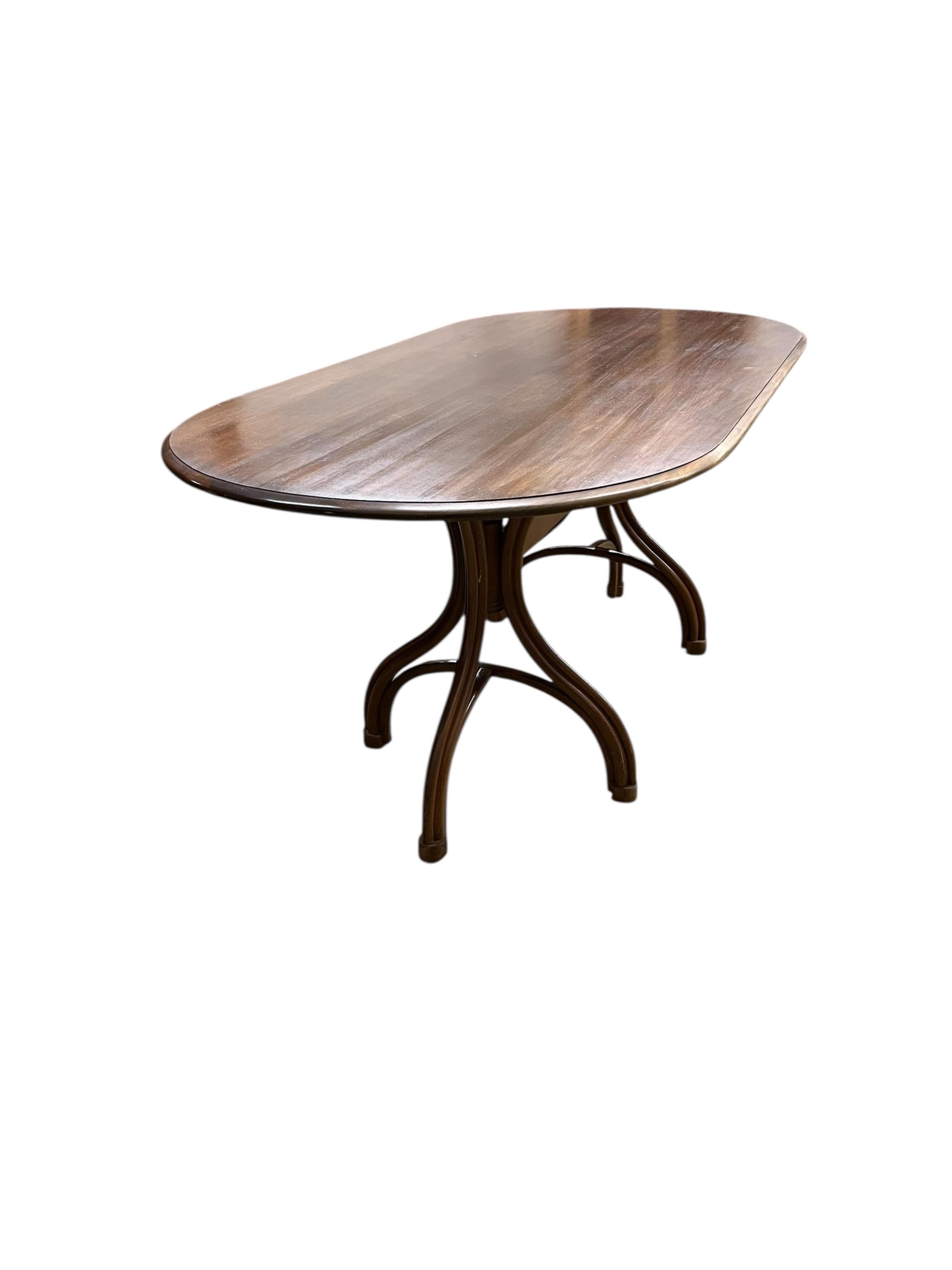 A Dinette caned beech and mahogany bentwood dining suite, comprising: dining table, width 180cm, depth 90cm, height 76cm and six elbow chairs